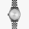 Lorier Hyperion GMT automatic watch caseback on white background, brushed steel case with engraved chevron pattern ring, five-link bracelet. 