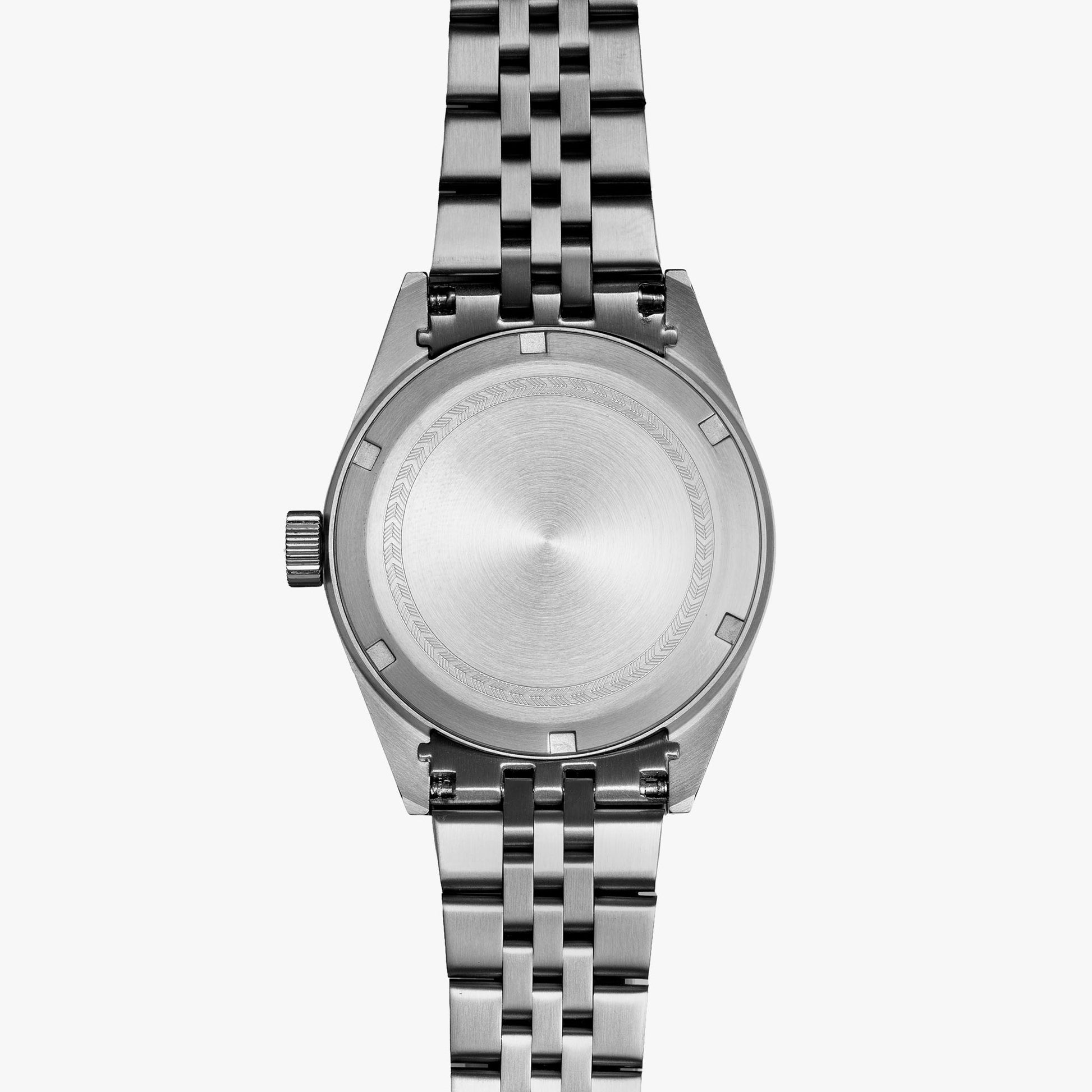 Lorier Hyperion GMT automatic watch caseback on white background, brushed steel case with engraved chevron pattern ring, five-link bracelet. 