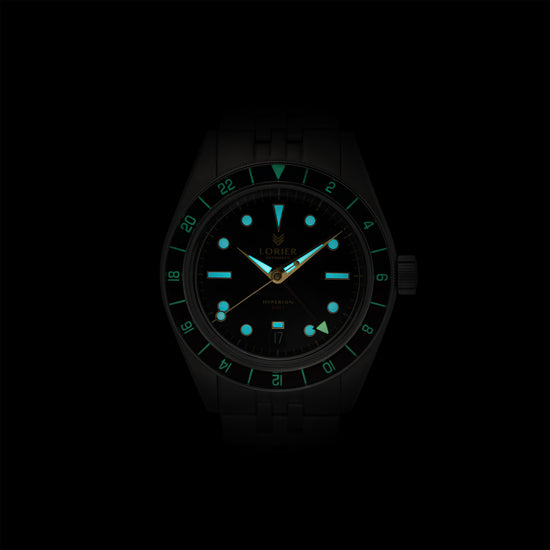Lorier Hyperion GMT automatic watch in darkness showing Superluminova lume on hour markers, handset, and GMT bezel numerals glowing blue-green against black background.