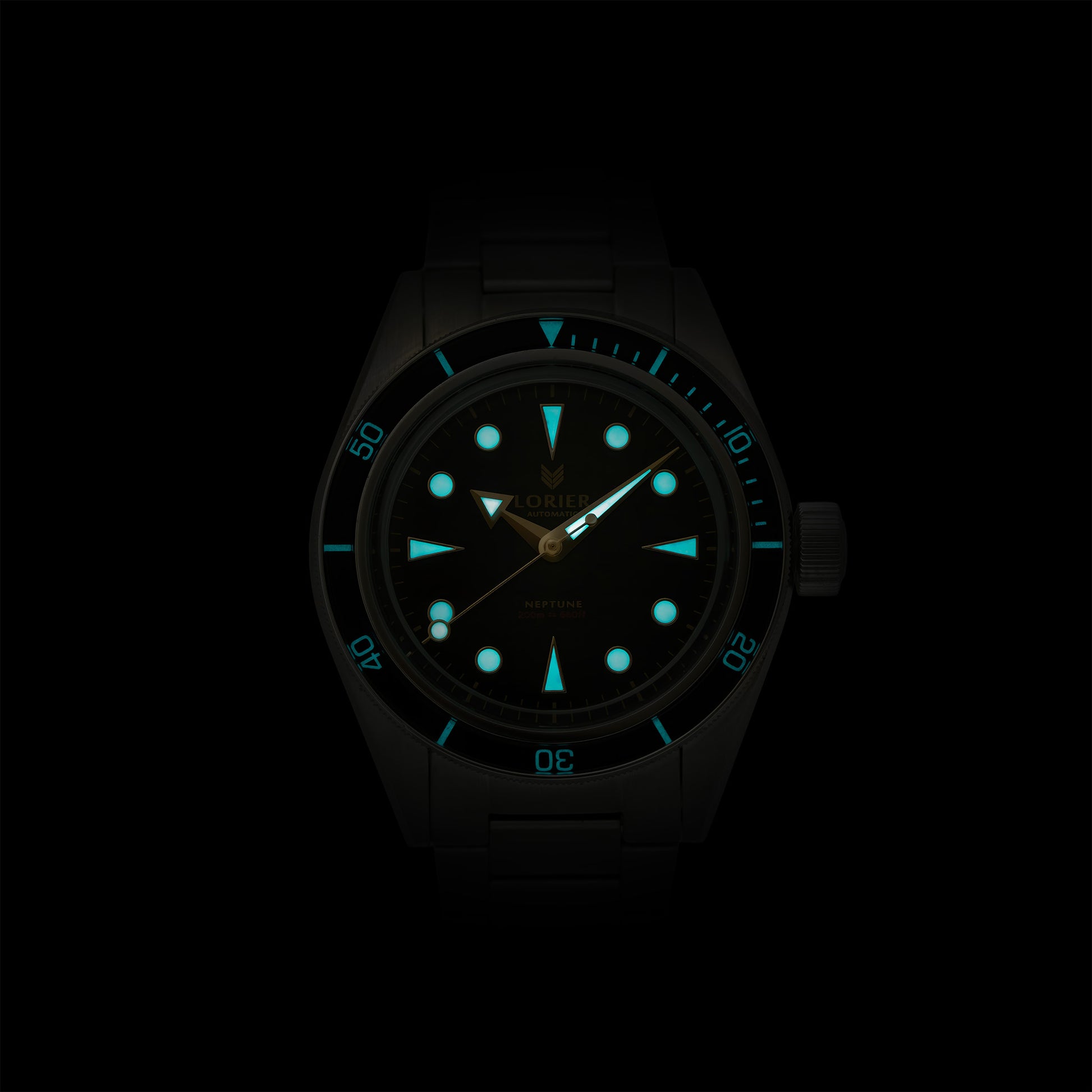 Lorier Neptune automatic dive watch in darkness showing Superluminova lume on hour markers, handset, and dive bezel numerals glowing blue-green against black background.